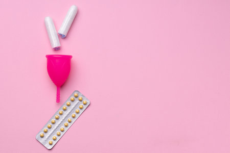 Menstrual cup and oral contraceptive pills top view