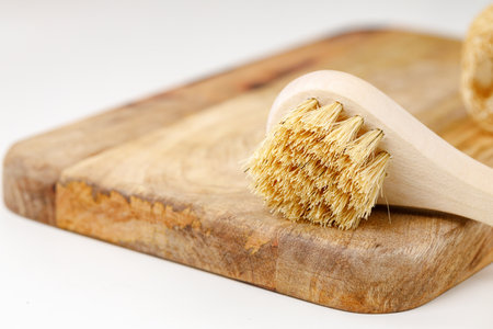 Wooden massage body brush in the bathroomの写真素材