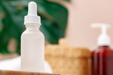 Glass container of cosmetic oil with pippetteの写真素材