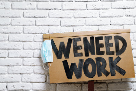 Ptotestive placards against job loss during coronavirus pandemicの写真素材