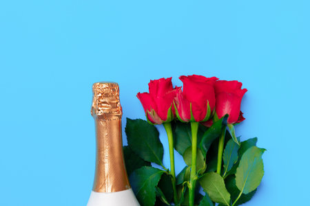 Bouquet of roses and champagne top viewの写真素材