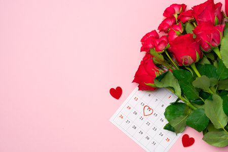 February calendar and red roses top viewの写真素材