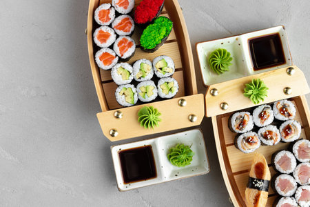 Set of maki sushi on wooden boat trayの写真素材