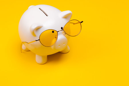 piggy bank with glassesの写真素材