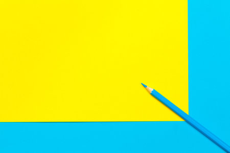 Blue pencil on color block background top viewの写真素材