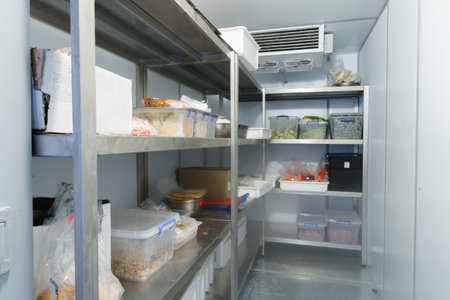 Refrigerator chamber with steel shelves in a restaurant