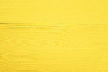 Bright yellow wooden background for your designの写真素材