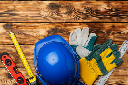 Hardhat and gloves of construction worker top viewの写真素材