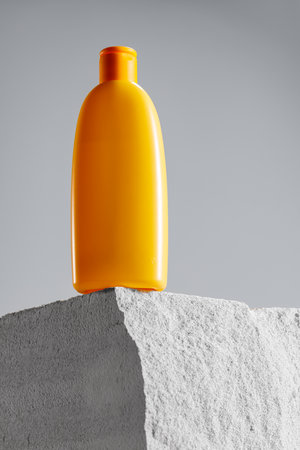 Cosmetic jar on gray cinder block close upの写真素材