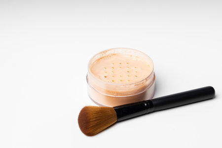 Decorative cosmetics face powder and brush close upの写真素材