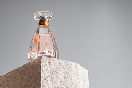 Transparent fragrance bottle on gray .cinder blockの写真素材