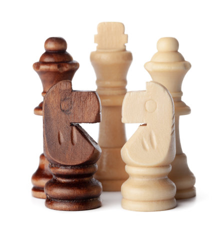 White and brown wooden chess pieces on white backgroundの写真素材