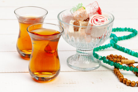 Cup of hot tea and a plate of turkish dessertsの写真素材