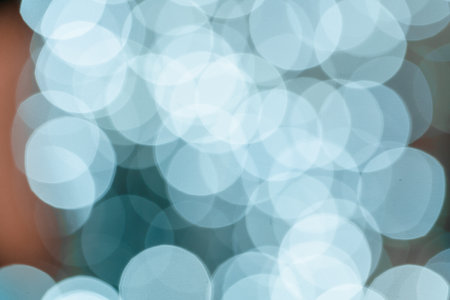 Blurred blue Christmas holiday light bokeh backgroundの写真素材
