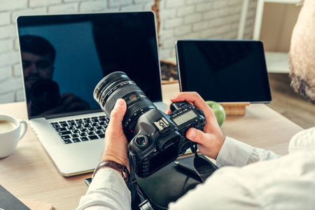 Working table of a photographer close upの写真素材