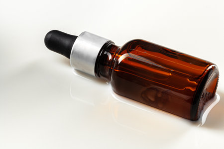 Skincare serum bottle on a light beige backgroundの写真素材