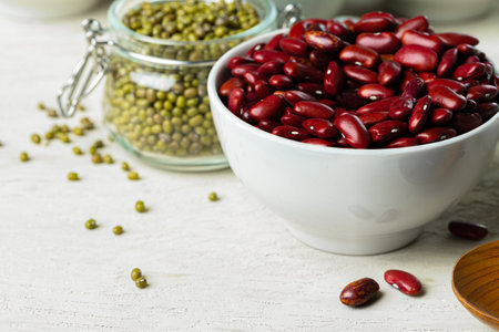 Raw cereals or beans in glass jars close up. Vegan and vegetarian food.