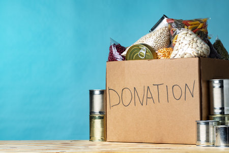 Food donations on the table. Text Donation.の写真素材