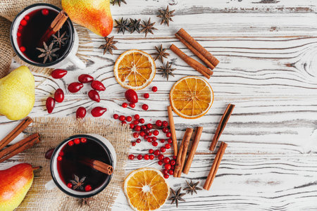 Autumn composition with hot mulled wine and spices on wooden backgroundの写真素材