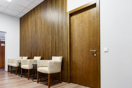 Office waiting area with arm chairs and coffee tableの写真素材