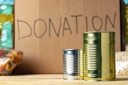 Food donations on the table. Text Donation.の写真素材