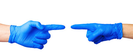 Male and female hands in medical gloves stretch to each other. Help concept.