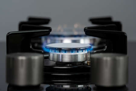 Burning gas stove burner in a kitchenの写真素材