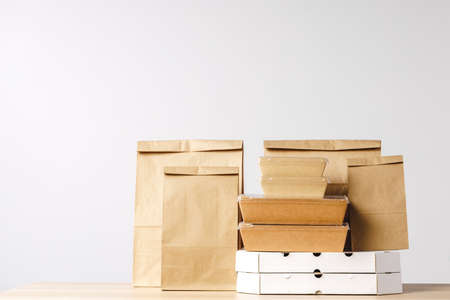 Assortment of various food delivery containers on table