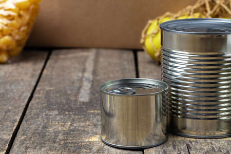 Donations food with canned food on the table background. Donate concept.