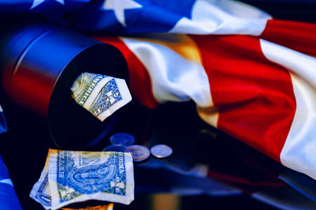 Oil prices fall concept. Oil barrel against decline chartの写真素材