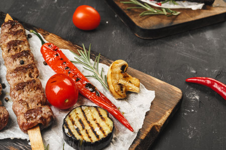Grilled Lula kebab on skewers served on wooden board