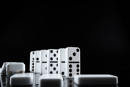 Close up of Domino pieces on black background