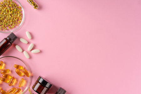 Herbs and Herbal dietary supplements top view on pink backgroundの写真素材