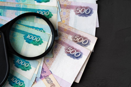 Magnifying Glass on the Russian Currency Rubles