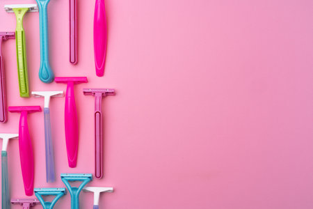 Female disposable razors on pink background top viewの写真素材