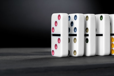 Domino game. Dominoes on a black tableの写真素材