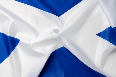 Folded national flag of Scotland, fabric background