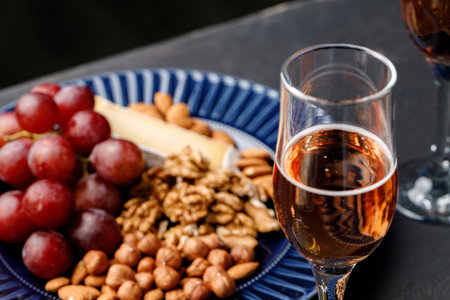 Close up of nuts and grapes on plateの写真素材