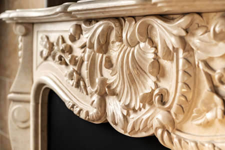 Carved patterns on stone luxury fireplace close upの写真素材