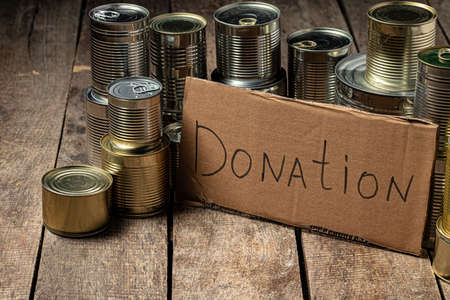 Food donations on the table. Text Donation.の写真素材
