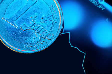 Euro coin on stock chart. Financial investment concept.の写真素材