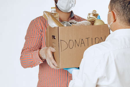 Donation box of food for people suffering from coronavirus pandemiaの写真素材