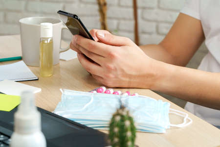 Vitamins and medical mask on office table, corona virus protection concept