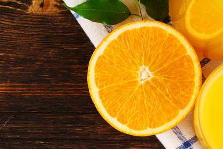 Close up of orange juice bottle with napkin on wooden table