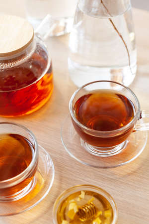 Close up of glass tea cup with honeyの写真素材