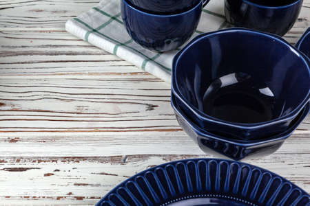 Wooden kitchen counter with new dishware on itの写真素材