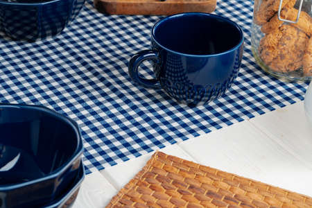 Classic blue empty ceramic tea cup on kitchen table