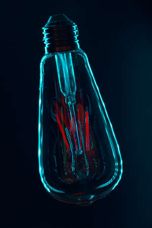 Light bulb on black background close up