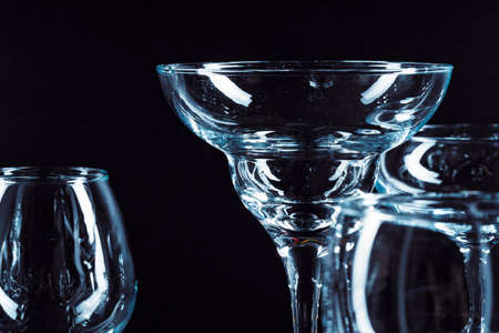 Empty glasses for drinks on dark background