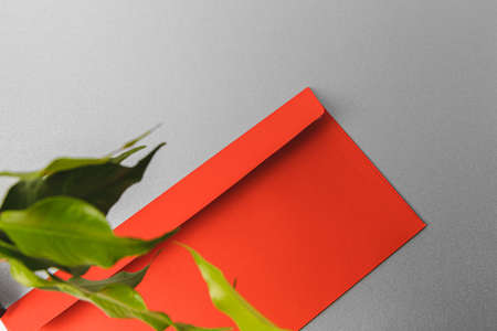 Flat lay craft paper card mockup with leaves